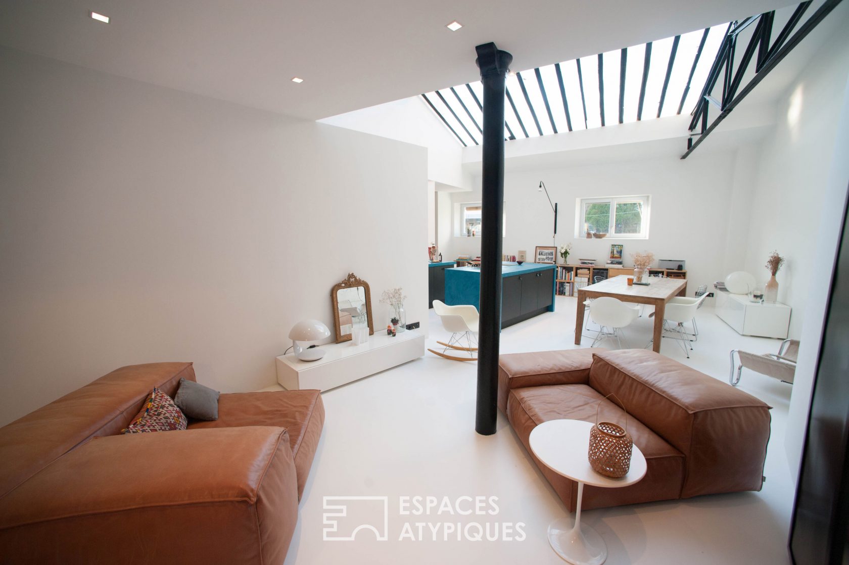 Architect’s loft under glass roof