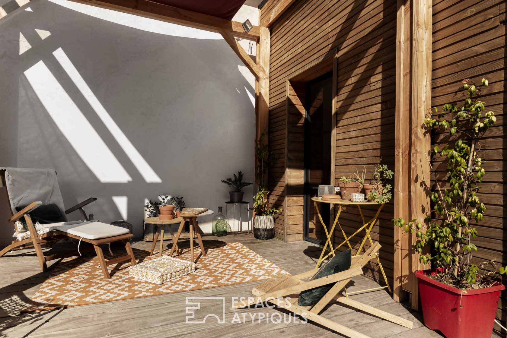 Decorative house with wooden terrace