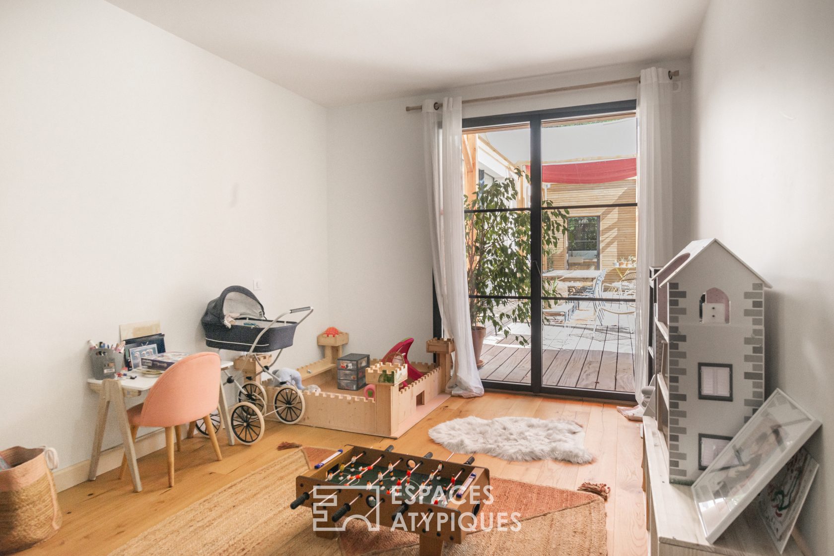 Decorative house with wooden terrace