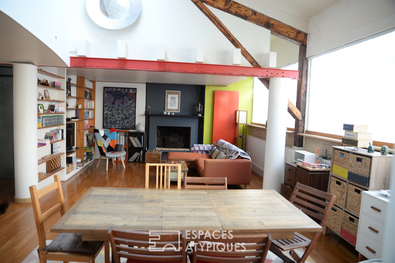 Colorful loft with exposed beams