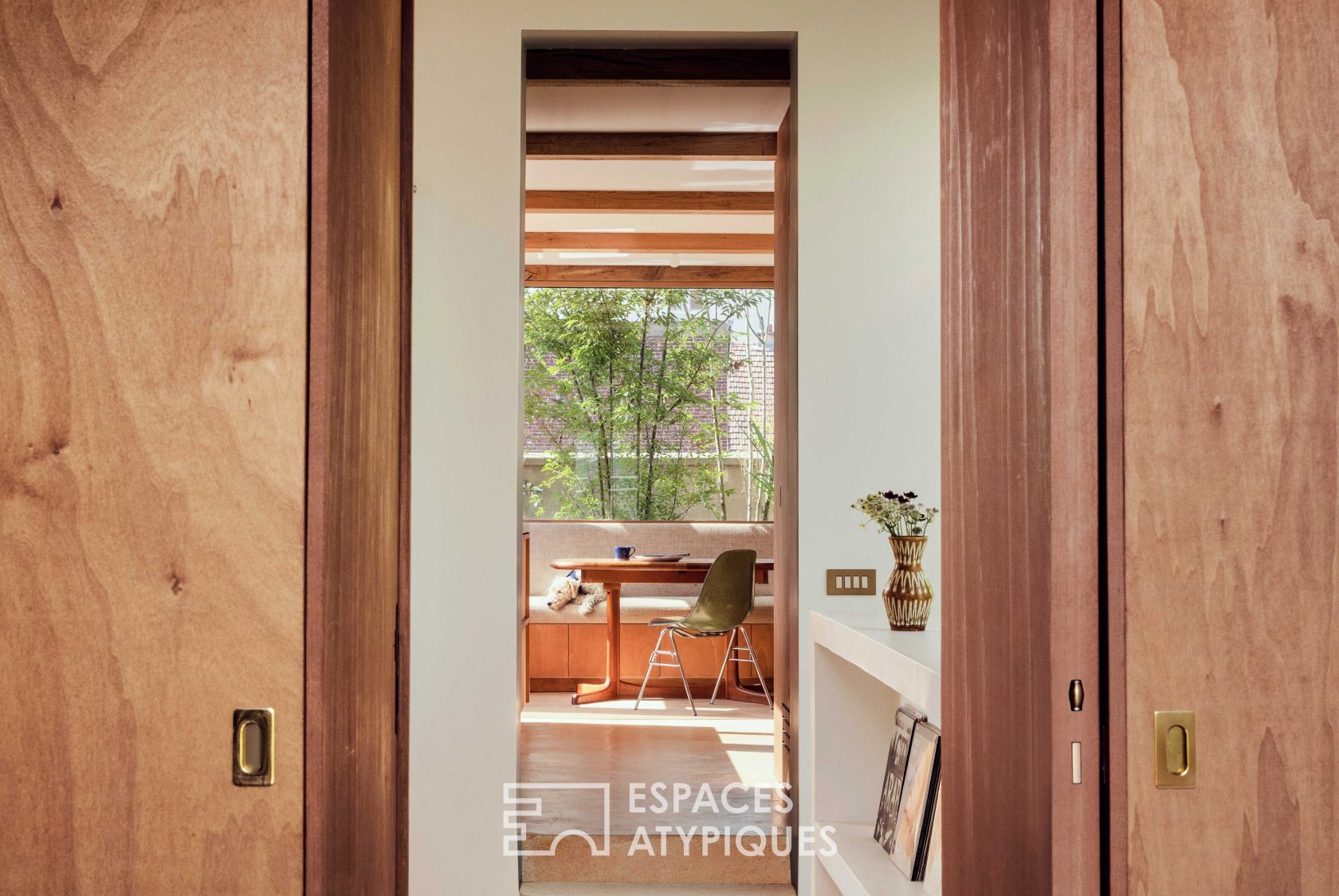 House with photo studio in raw and seventies style