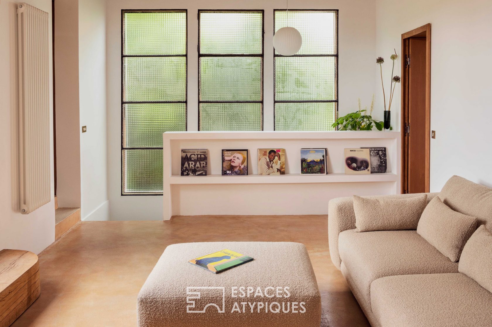 House with photo studio in raw and seventies style