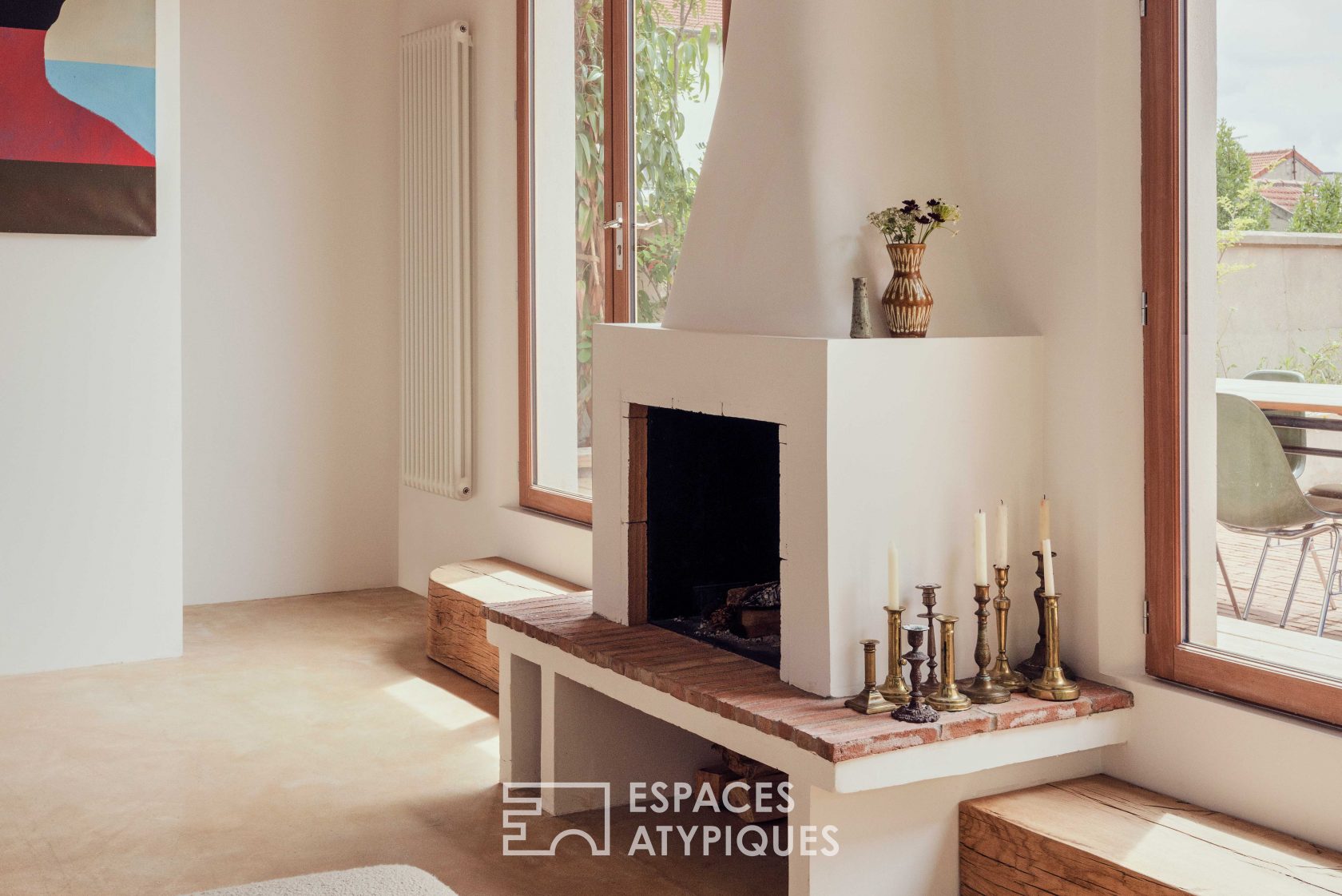 House with photo studio in raw and seventies style