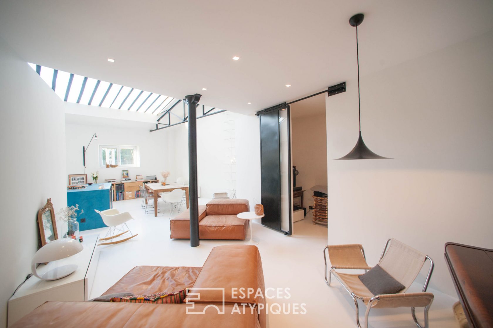 Architect’s loft under glass roof