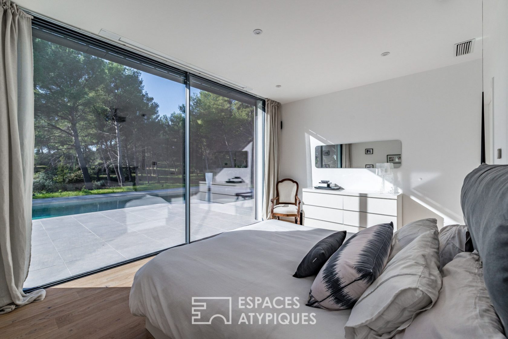 Contemporary architect’s house with view on pine forest