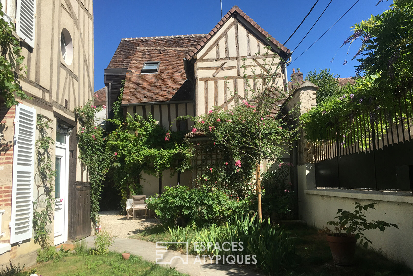 Half-timbered house and its flower garden