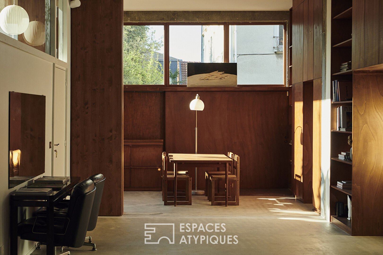 House with photo studio in raw and seventies style