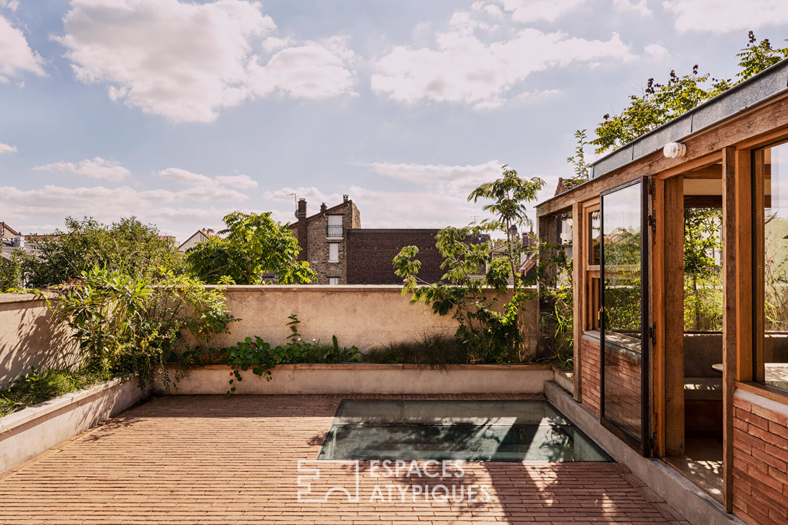 House with photo studio in raw and seventies style