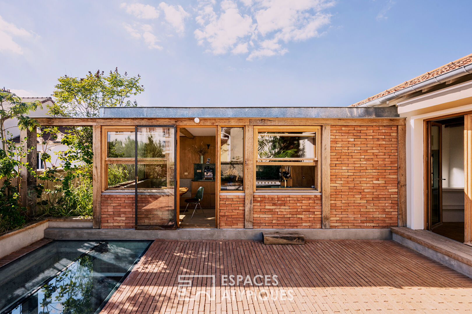 House with photo studio in raw and seventies style