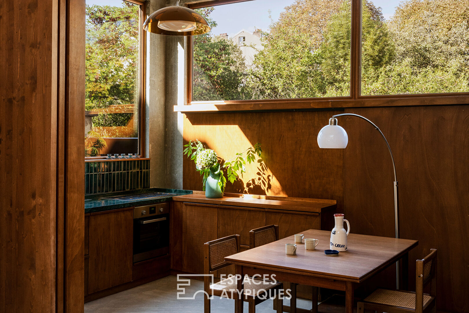 House with photo studio in raw and seventies style