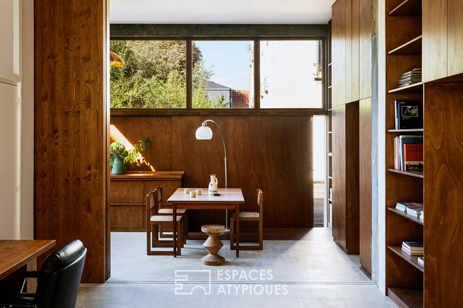 House with photo studio in raw and seventies style