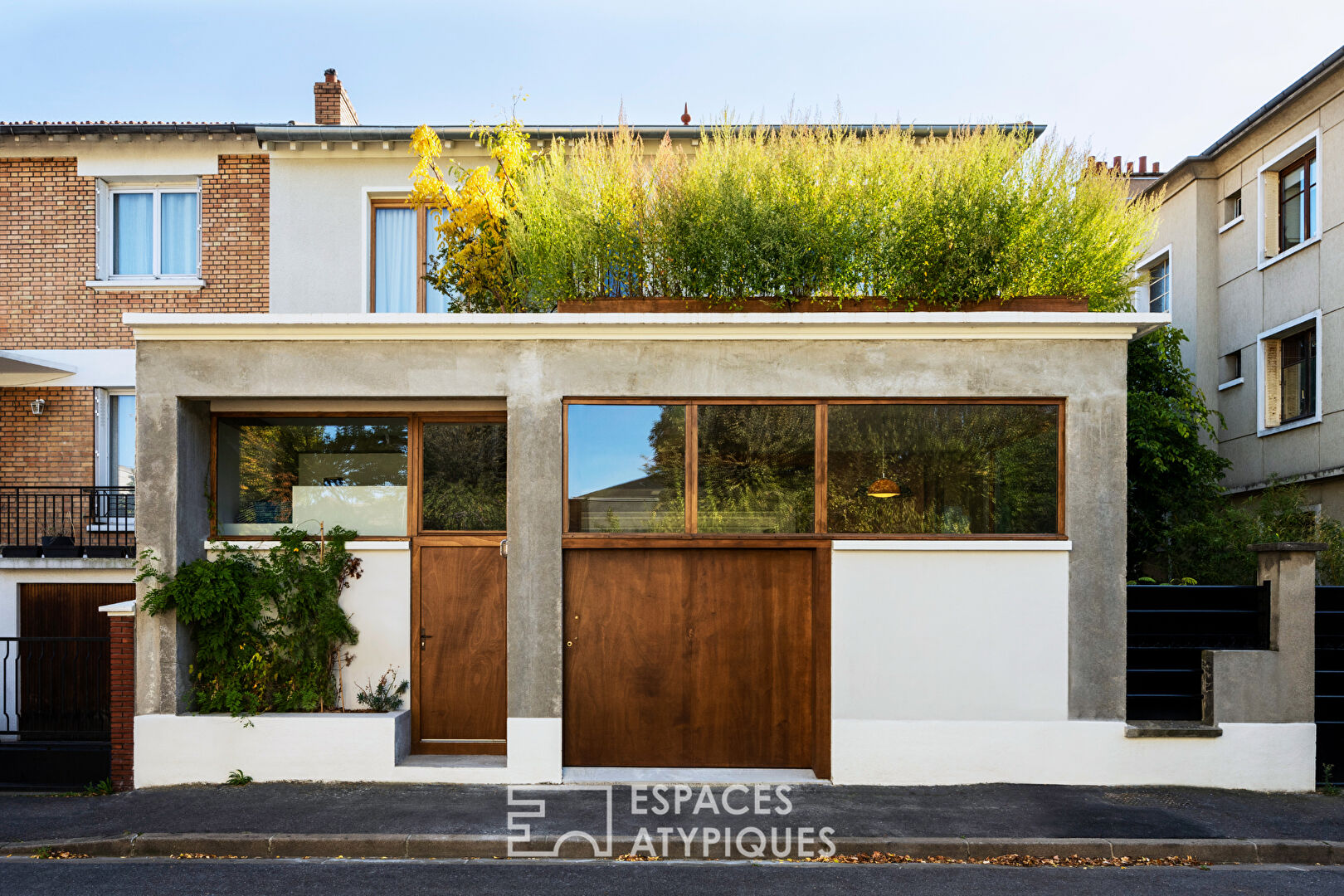 House with photo studio in raw and seventies style