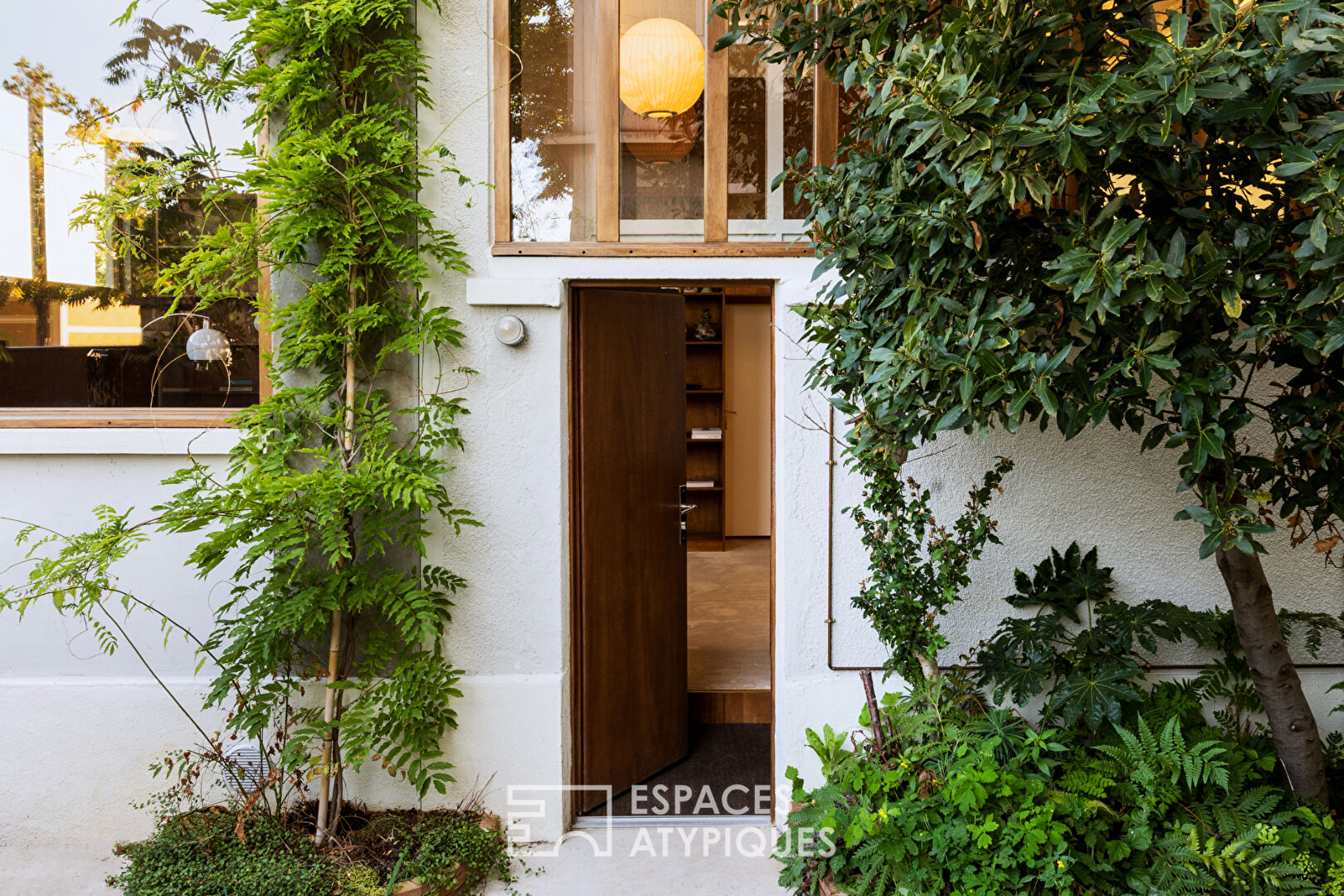 House with photo studio in raw and seventies style