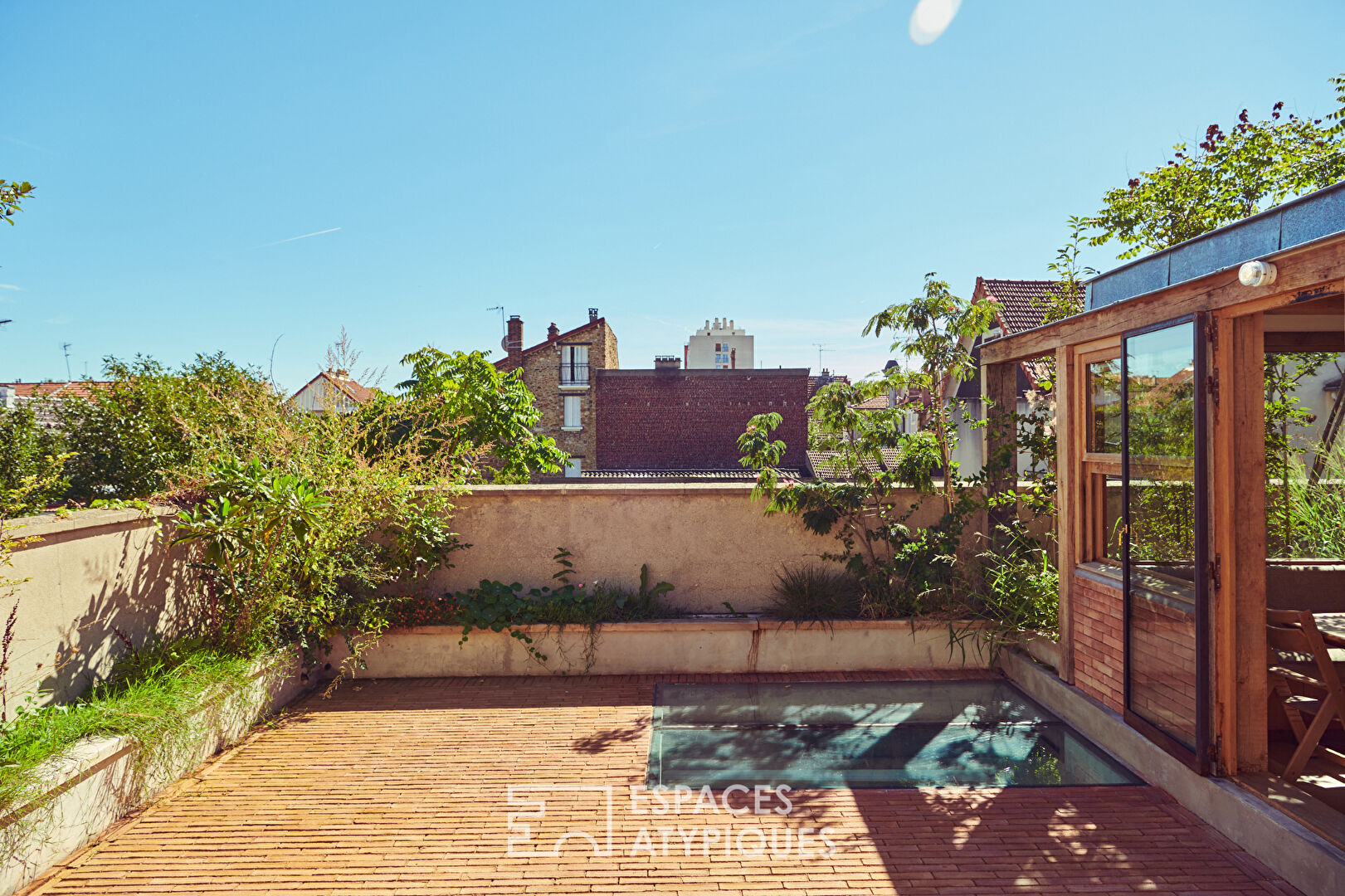 House with photo studio in raw and seventies style
