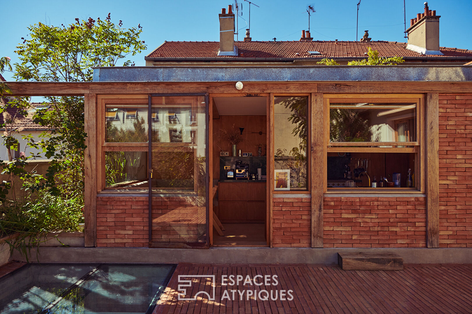 House with photo studio in raw and seventies style