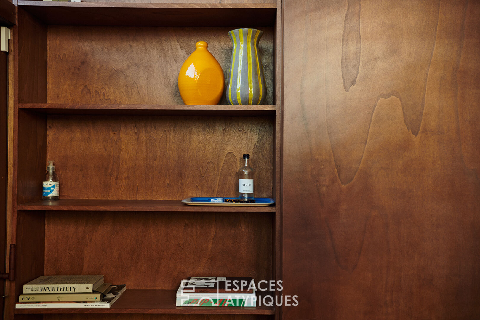 House with photo studio in raw and seventies style