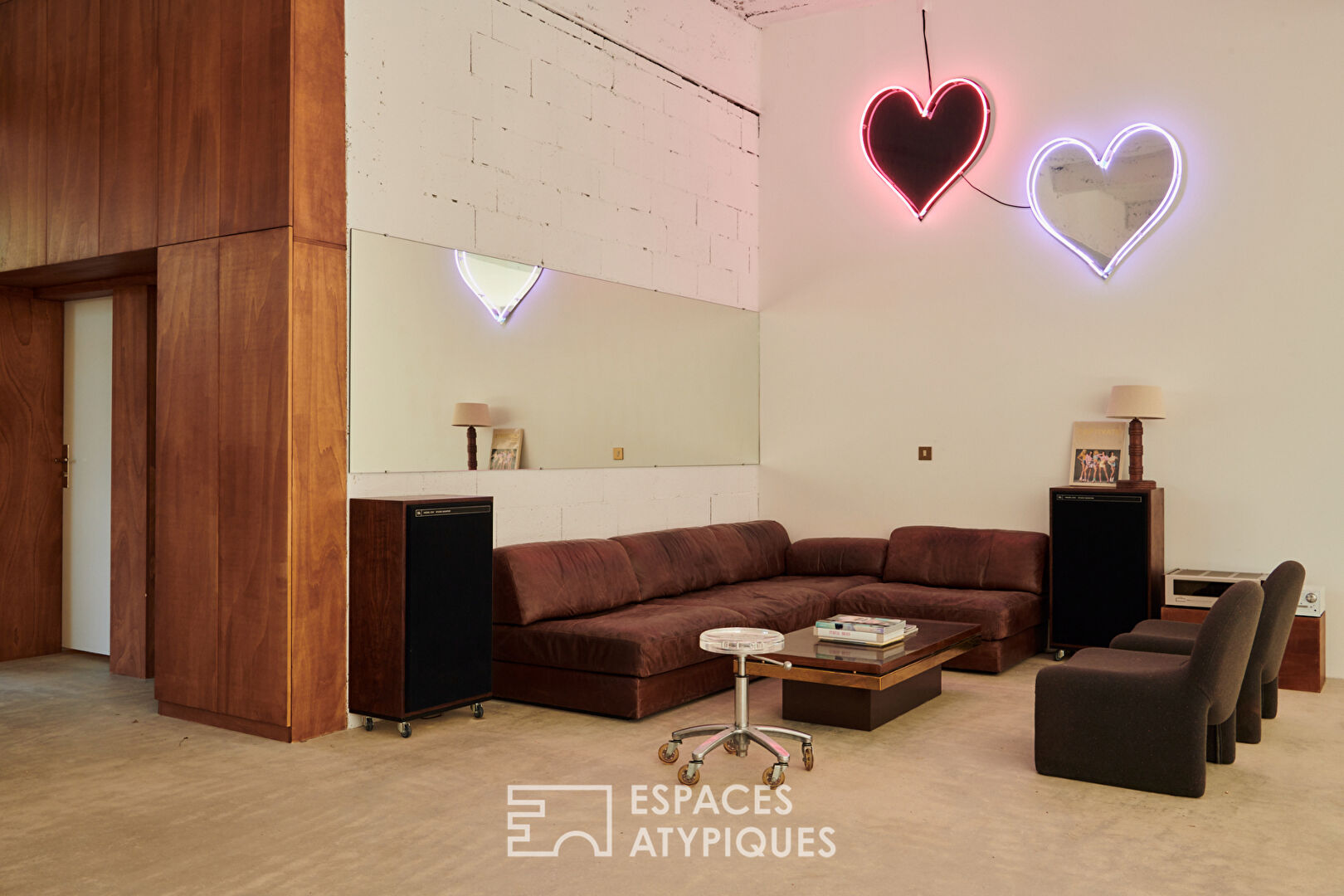 House with photo studio in raw and seventies style