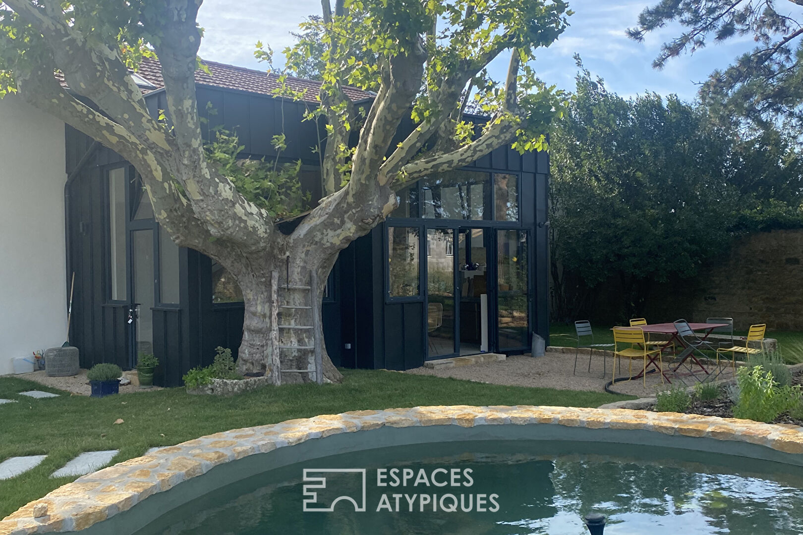 Old and modern house with swimming pool
