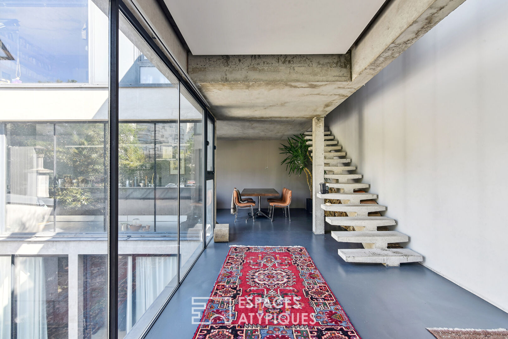 Contemporary raw concrete duplex